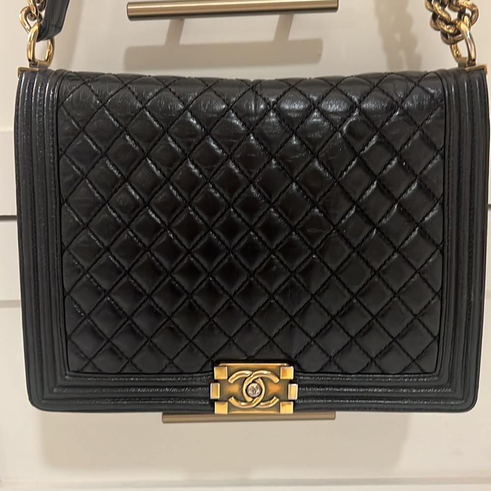 Chanel Boy Large quilted handbag black lambskin leather gold-tone hardware.